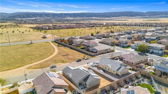 birds eye view of property with a residential view and a mountain view