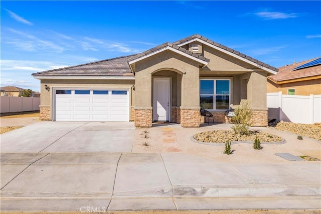 ranch-style house featuring stone siding, fence, and stucco siding