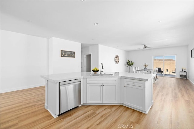 5651 W W Ave Unit J15, Lancaster, CA 93536 - kitchen featuring stainless steel dishwasher, light wood-style floors, and ceiling fan