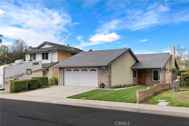 view of front facade with a garage, driveway, a shingled roof, a front lawn, and stucco siding