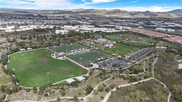 birds eye view of property featuring a mountain view