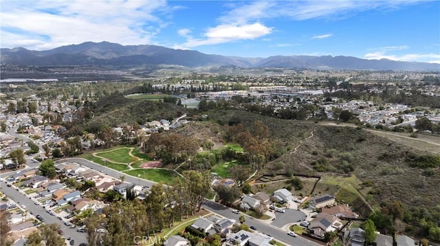 drone / aerial view featuring a residential view and a mountain view