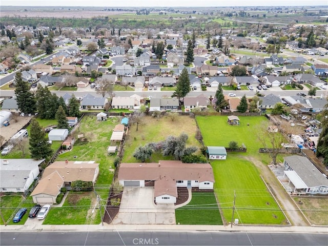 birds eye view of property with a residential view