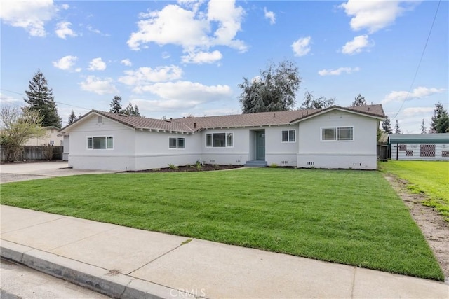 ranch-style home with a front yard, fence, and entry steps