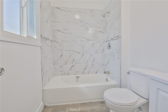 full bathroom with toilet and shower / bathing tub combination