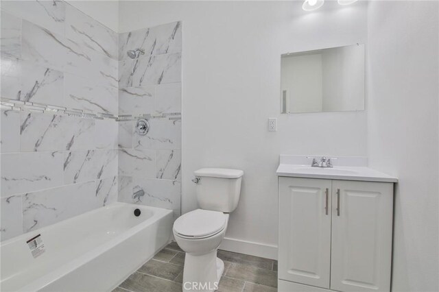 full bathroom featuring shower / bathtub combination, toilet, vanity, baseboards, and wood tiled floor