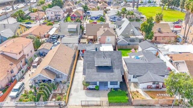 birds eye view of property with a residential view