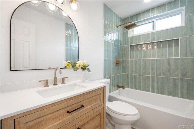 bathroom featuring shower / bathing tub combination, vanity, and toilet