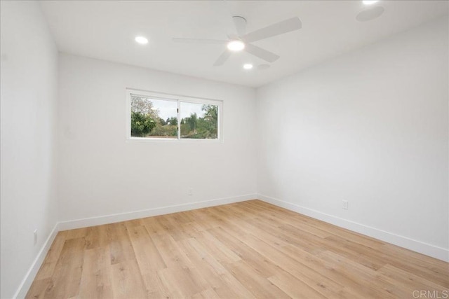 unfurnished room with light wood-style floors, recessed lighting, and baseboards