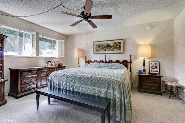 bedroom with light carpet, a textured ceiling, and a ceiling fan