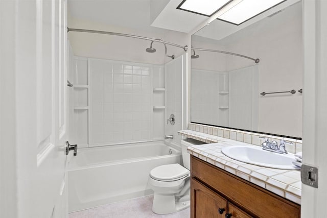 bathroom with tub / shower combination, toilet, vanity, and tile patterned flooring