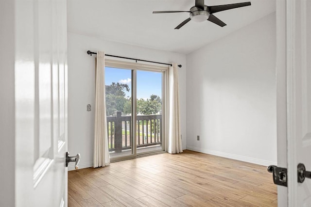 unfurnished room featuring a ceiling fan, baseboards, and light wood-type flooring