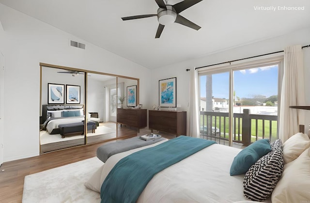 bedroom with access to exterior, visible vents, ceiling fan, lofted ceiling, and wood finished floors