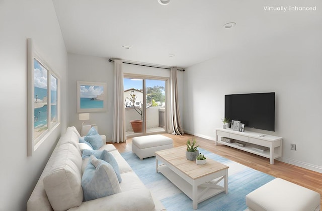 living room with baseboards and light wood-style flooring