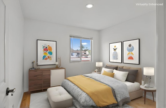 bedroom with recessed lighting, light wood-type flooring, and baseboards