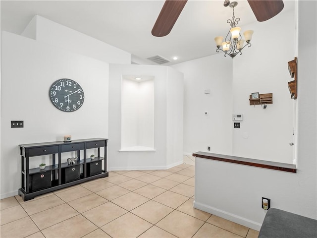 interior space with visible vents, a notable chandelier, baseboards, and light tile patterned floors