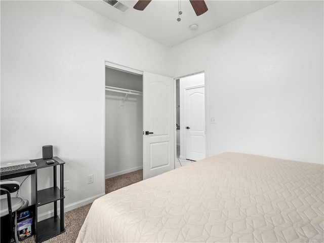 bedroom with visible vents, baseboards, a ceiling fan, carpet, and a closet