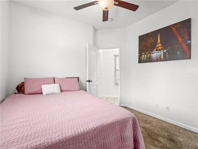 bedroom with carpet flooring, ceiling fan, and baseboards