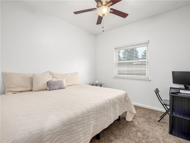 carpeted bedroom with baseboards and a ceiling fan