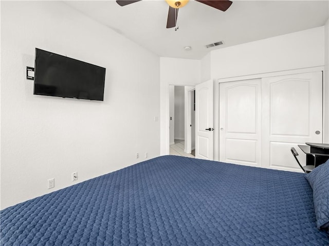 unfurnished bedroom featuring ceiling fan, a closet, and visible vents