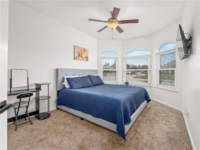 bedroom with carpet, baseboards, and a ceiling fan