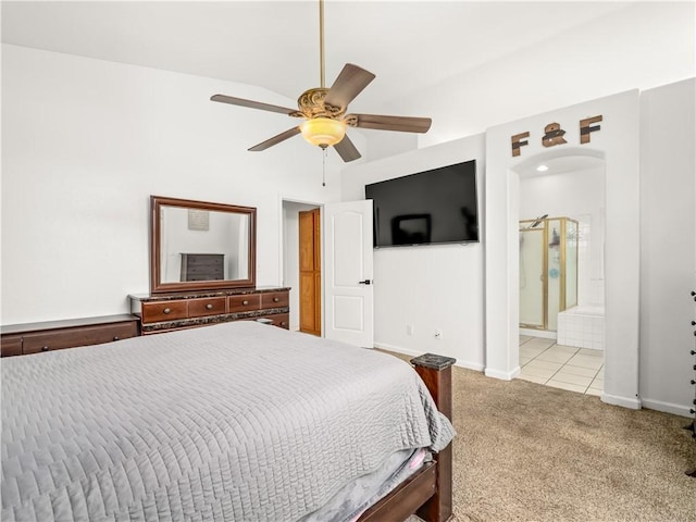 bedroom with arched walkways, ceiling fan, baseboards, and light colored carpet