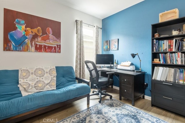 office space featuring wood finished floors and baseboards