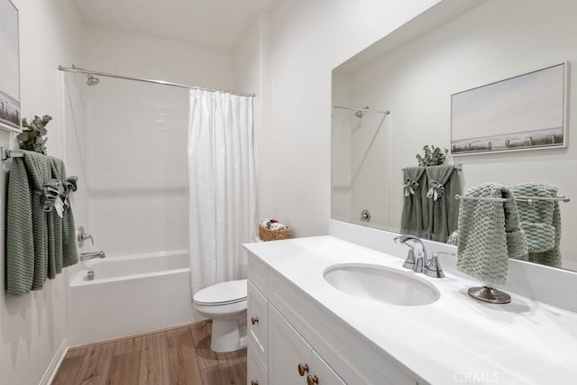 full bath featuring shower / tub combo, vanity, toilet, and wood finished floors