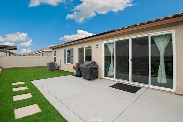 back of property featuring a yard, fence, a patio, and stucco siding