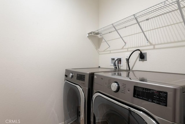 laundry area with laundry area and washing machine and dryer