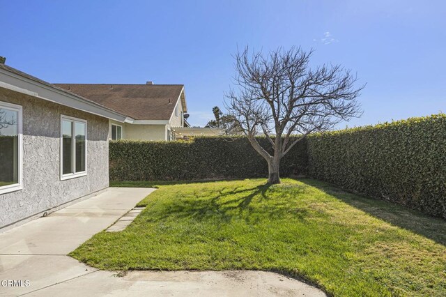 view of yard featuring a patio area and fence