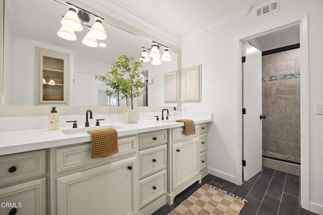 full bath with double vanity, visible vents, tile patterned floors, crown molding, and a sink