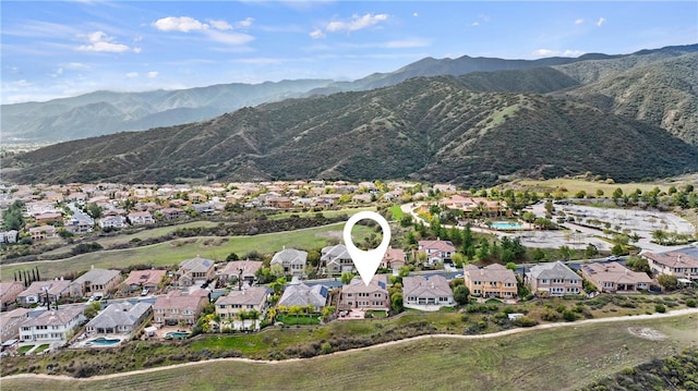 drone / aerial view with a residential view and a mountain view