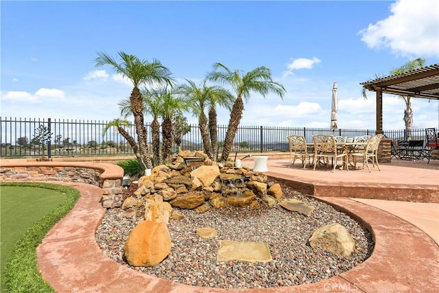 exterior space featuring a fenced backyard and a pergola