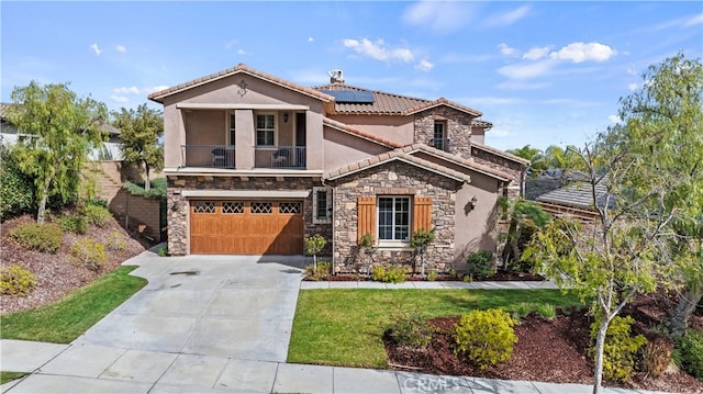 mediterranean / spanish house featuring solar panels, concrete driveway, a balcony, an attached garage, and stucco siding