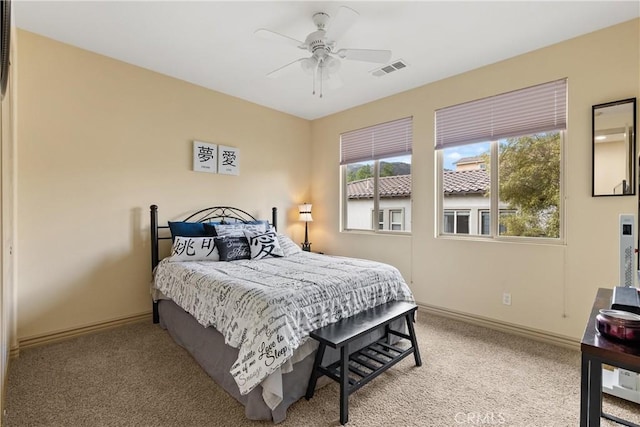 8072 Soft Winds Dr, Corona, CA 92883 - carpeted bedroom featuring multiple windows and ceiling fan