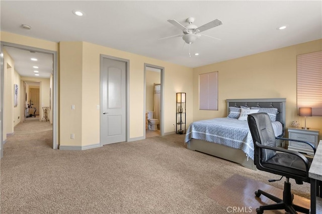 carpeted bedroom featuring recessed lighting, ceiling fan, baseboards, and ensuite bathroom