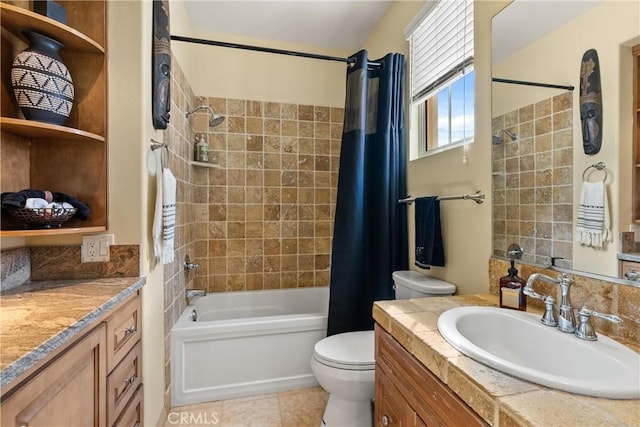 bathroom with toilet, tile patterned flooring, shower / bath combo with shower curtain, and vanity