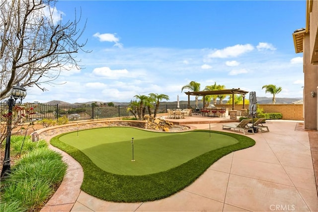 8072 Soft Winds Dr, Corona, CA 92883 - view of property's community with an area to practice putting, a patio area, and a gazebo