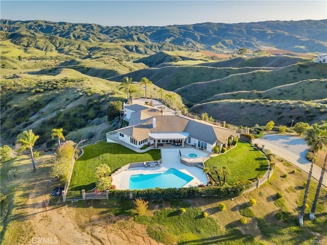 drone / aerial view featuring a mountain view