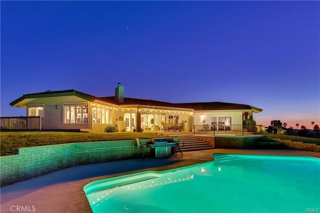 outdoor pool featuring a patio