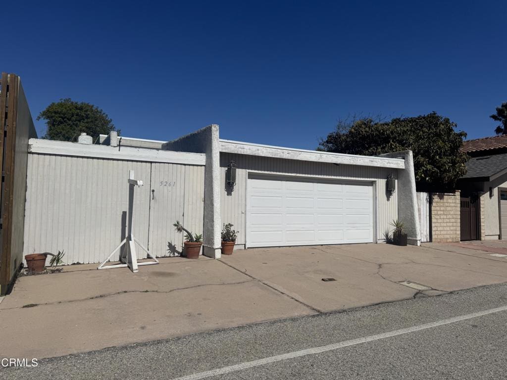 garage with concrete driveway