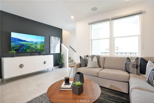 living area with recessed lighting and stairs