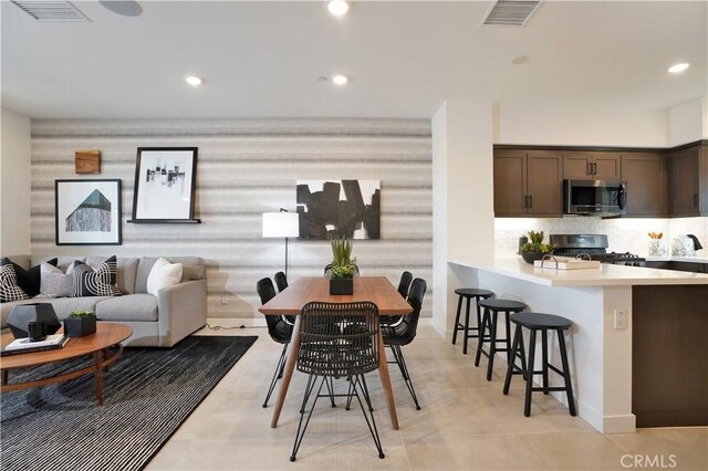 dining area featuring recessed lighting and visible vents