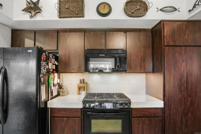 kitchen featuring black appliances and light countertops