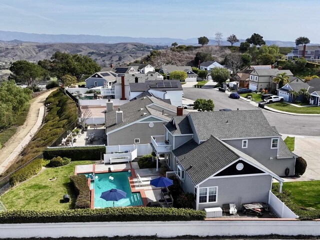 birds eye view of property with a residential view and a mountain view