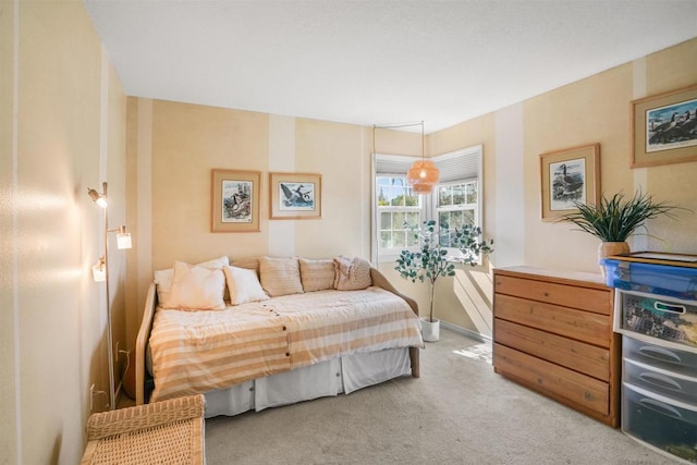 bedroom with light colored carpet