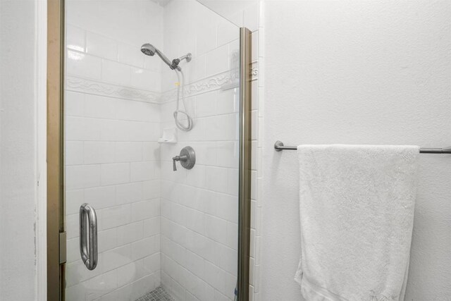 bathroom with a stall shower