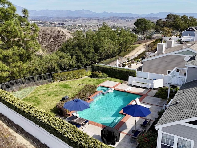 birds eye view of property with a mountain view