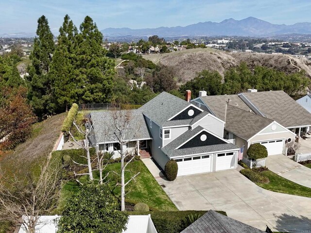 birds eye view of property featuring a mountain view